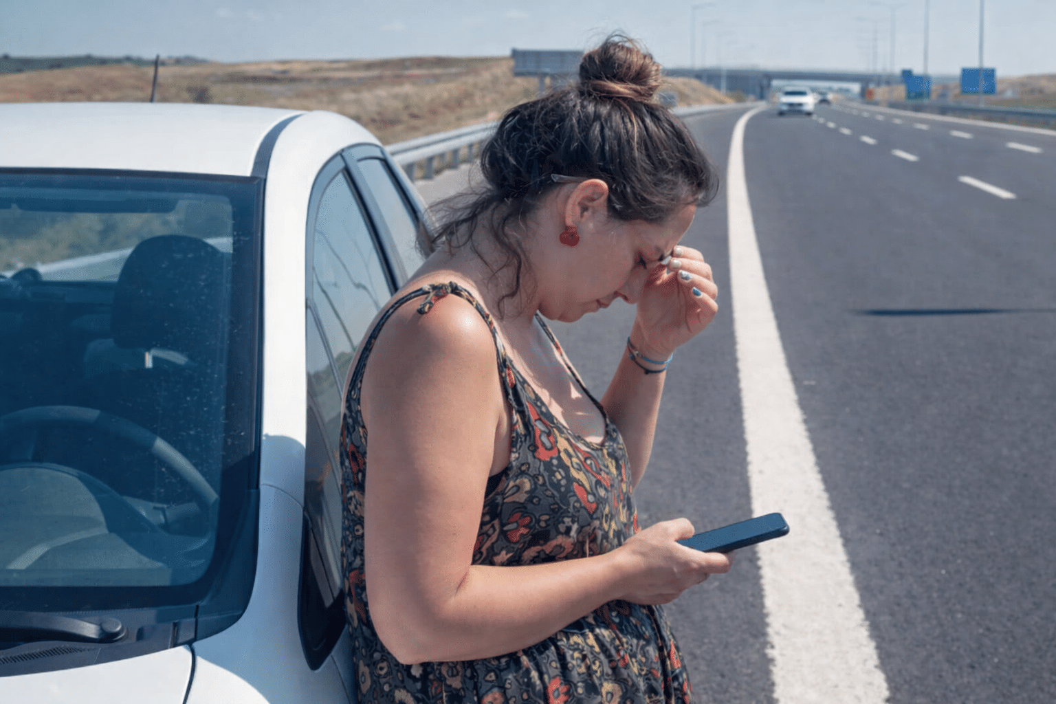 Woman on the phone highway-side
