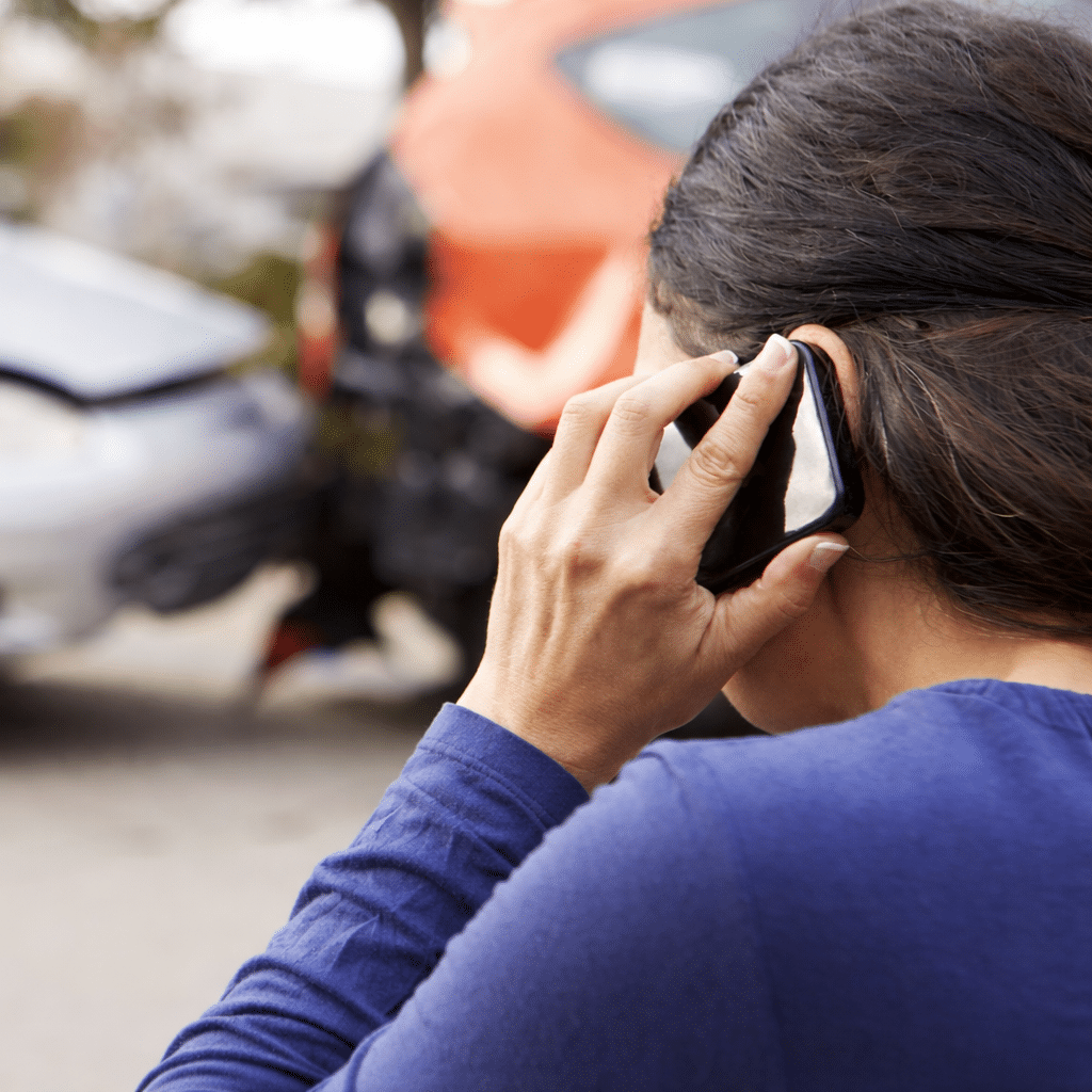 Person making a phone call after an accident